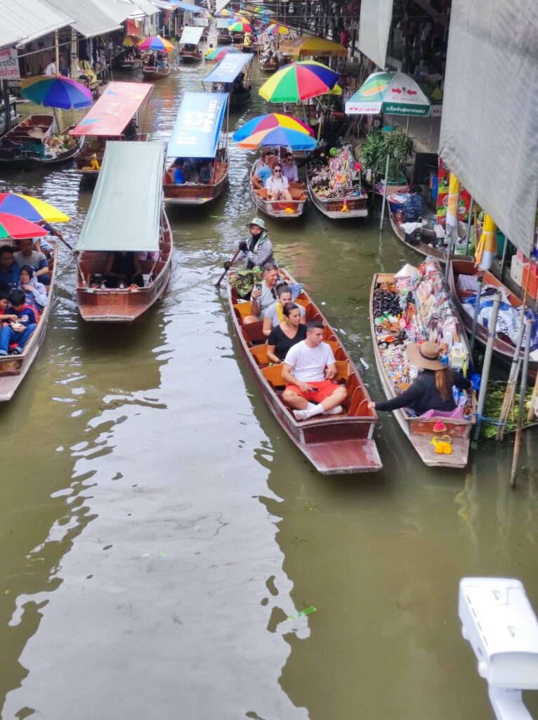 Vendors selling from their boats at Damnoen Saduak Floating Market.